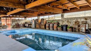 an indoor swimming pool in a house at Quinta Los Doctores - Heated pool in Ensenada