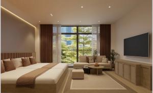 a bedroom with a large bed and a flat screen tv at Grand Central Hotel- Vinhomes Ocean Park 3 in Ðình Loan