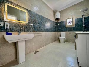 a bathroom with a sink and a toilet at Blue House villa in Marsa Matruh +43 photos
