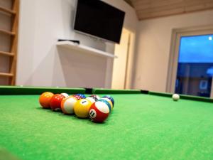 a row of pool balls on a pool table at 10 person holiday home in Odder in Odder +35 photos