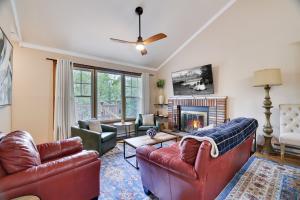 a living room with two couches and a fireplace at Emerald Escape Lake, Theater, Game Room & More! in Long Pond