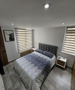 Una cama o camas en una habitación de Modern Apartment In Cajica
