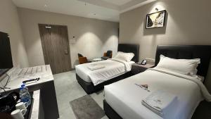 Ένα ή περισσότερα κρεβάτια σε δωμάτιο στο Hotel APS