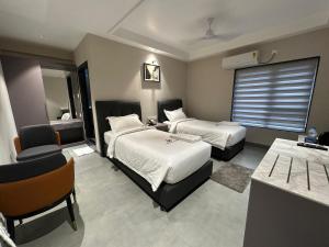 Ένα ή περισσότερα κρεβάτια σε δωμάτιο στο Hotel APS