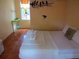 Postel nebo postele na pokoji v ubytování Ban Tonnam Resort