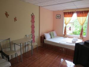 Postel nebo postele na pokoji v ubytování Ban Tonnam Resort + 37 fotografií