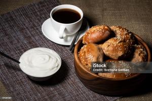 a bowl of bagels next to a cup of coffee at AMcroos in Negombo