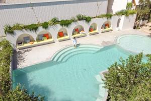 an overhead view of a swimming pool at a hotel at cara cara resort in Ko Larn