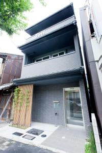 a building with a door on the side of it at Kyostay Iroha Toji Annex in Kyoto