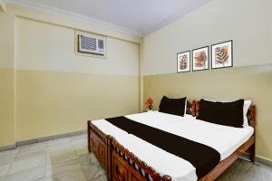 Ένα ή περισσότερα κρεβάτια σε δωμάτιο στο Hotel O Proddatur Crossway Formerly Thallam Residency +21 φωτογραφίες
