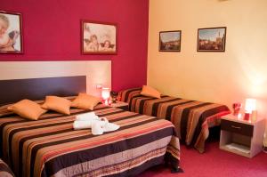 Tempat tidur dalam kamar di Hotel San Lorenzo