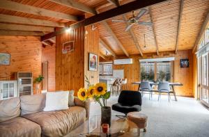 a living room with a couch and a table at Spacious, Pet Friendly, Near Boat Ramp and Water in Clifton Springs