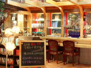 a book store with two chairs and a counter at Dalian Zhongshan Hotel in Dalian