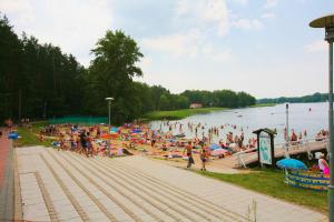 a large crowd of people at a beach at Apartament Niebieskie Narie in Kretowiny