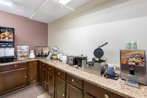 a kitchen with a counter top with a coffee maker at Americas Best Value Inn Beatrice in Beatrice