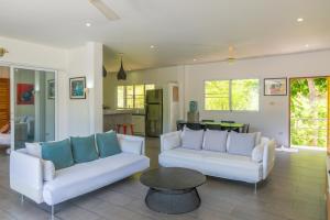 a living room with two white couches and a table at 3br Villa Private Pool 10min To Beach in Mae Nam