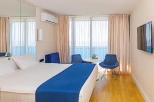 Postel nebo postele na pokoji v ubytování New Orbi city batumi + 32 fotografií