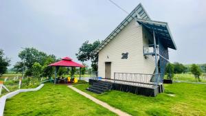 a house with a red roof and a gazebo at Weekstays in Gauli Palāsia +5 photos