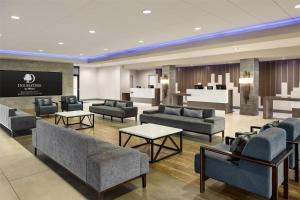 a waiting room with couches and tables at DoubleTree by Hilton Bloomington Minneapolis South in Bloomington +49 photos