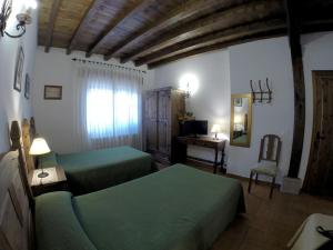 Posteľ alebo postele v izbe v ubytovaní Casa Rural El Regajo Valle del Jerte