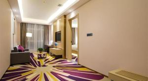a hotel room with a living room with a large rug at Lavande Hotels·Anyang Wojin Wanda Plaza in Anyang