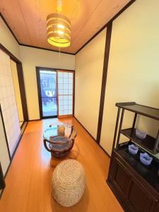 a room with a table and a bowl on the floor at 夏様楽善 Historic Kyoto Machiya,Experience Japanese Lifestyle Comfortably in Kyoto +53 photos