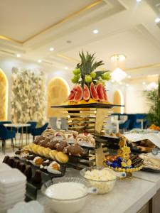 a buffet with many different types of food on a table at Tauke Khan Plaza in Shymkent