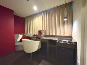 a small room with a desk and a bed at HOTEL AMANEK Osaka Namba in Osaka