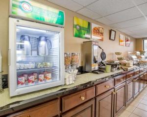 a fast food kitchen with an open refrigerator at Quality Inn Reidsville Hwy 29 in Reidsville +110 photos