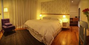 Postel nebo postele na pokoji v ubytování Hotel Casa Zapallar