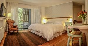 Postel nebo postele na pokoji v ubytování Hotel Casa Zapallar