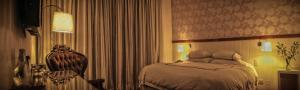 Postel nebo postele na pokoji v ubytování Hotel Casa Zapallar