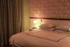 Postel nebo postele na pokoji v ubytování Hotel Casa Zapallar