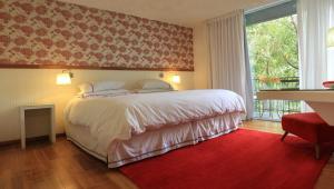Postel nebo postele na pokoji v ubytování Hotel Casa Zapallar