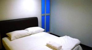 Postel nebo postele na pokoji v ubytování 1st Inn Hotel Shah Alam (SA13) + 18 fotografií