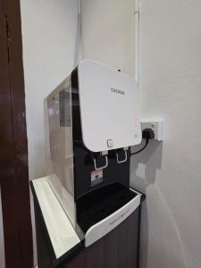 eine Kaffeemaschine auf einem Regal in der Unterkunft Popular! 4 pax Georgetown Heritage Pre-war House 2 Bedroom in George Town + 6 Fotos