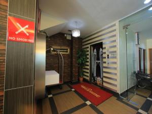 a hallway with a no smoking sign in a building at OYO 115 Hotel Safari 1 in Kuala Lumpur