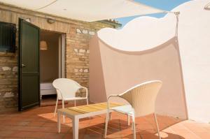 two chairs and a table on a patio at Lido Azzurro in Numana