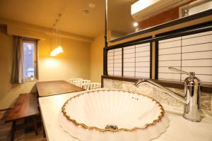 a bathroom with a sink and a counter top at the Moto Hotel Shinjuku in Tokyo +24 photos