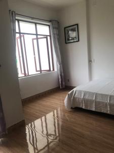 Postel nebo postele na pokoji v ubytování Dịch vụ lưu trú hảo hảo