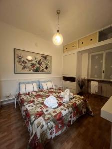 a bedroom with a bed with a quilt on it at Ancora Sul Naviglio in Rozzano
