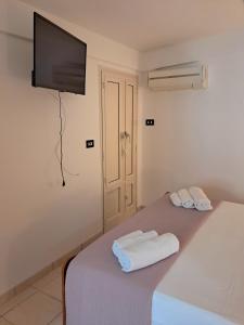 a bedroom with a bed with two towels on it at Villa Noesyr in Neviano +54 photos