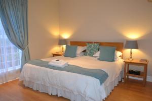 Ένα ή περισσότερα κρεβάτια σε δωμάτιο στο Bell Rosen Guest House