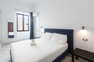 Ένα ή περισσότερα κρεβάτια σε δωμάτιο στο Aury Home Sorrento Coast