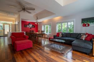 a living room with a couch and chairs and a table at Absolute comfort with SPA - Le Havre du Confort in Mille-Isles +36 photos