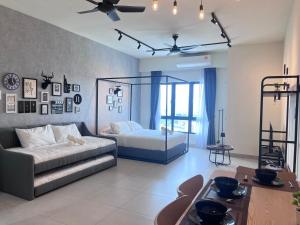 a living room with a bed and a couch at Edusphere near MMU UOC 2min Studio 2pax in Cyberjaya +18 photos