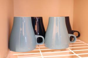 two vases sitting on top of a kitchen counter at Style Room in Osaka