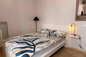 Postel nebo postele na pokoji v ubytování La Casa dei Sogni - Comfort nel Cuore di Gaeta