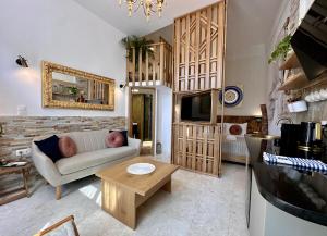 a living room with a couch and a table at Avra Guesthouse in Limenas