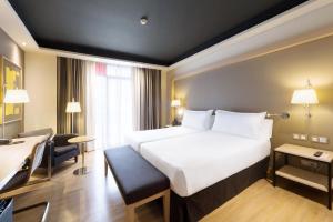 Ein Bett oder Betten in einem Zimmer der Unterkunft Hotel Jazz